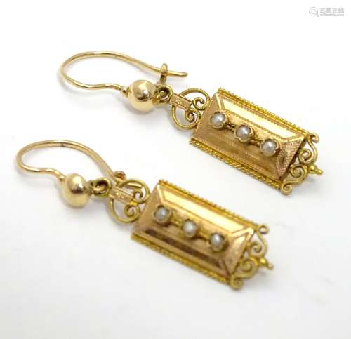 A pair of gold drop earrings set with seed pearls (unmarked - tests as 18ct) Approx 1