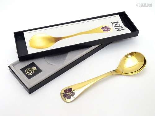 A Georg Jensen silver gilt and enamel 1974 year spoon, with floral enamel corn cockle decoration