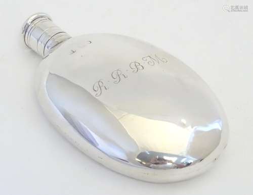 A Victorian silver hip flask of ovoid form engraved RRBM. Hallmarked London 1867, maker HJ Lias