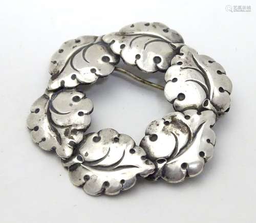 A Danish silver brooch of circular form with leaf detail. By Niel Erik From of Denmark 1 1/2