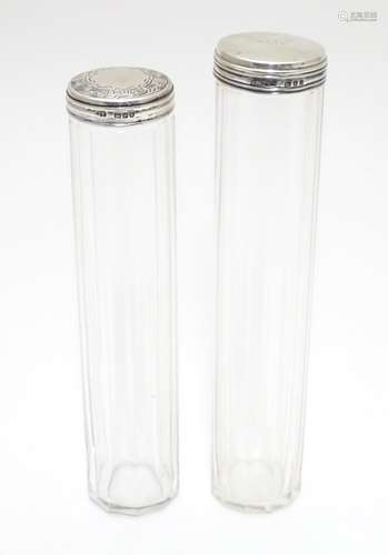 Two silver lidded glass vanity bottles. Hallmarked London 1910 maker Charles Fox & Co Ltd and London