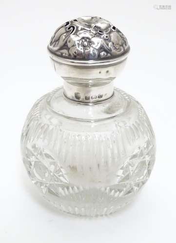 A cut glass perfume bottle with silver lid hallmarked Birmingham 1913 maker Boots Pure Drug Co. 3