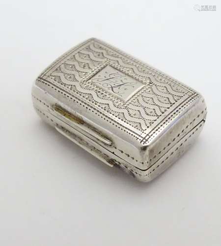 A Geo IV silver vinaigrette with engraved decoration and gilded interior. Hallmarked Birmingham 1828