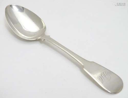 A Geo III Scottish silver fiddle pattern dessert spoon. Hallmarked Edinburgh 1817 maker Alexander