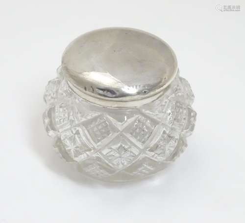 A small cut glass pot with silver top hallmarked Birmingham 1903 maker T H Hazlewood & Co. Approx