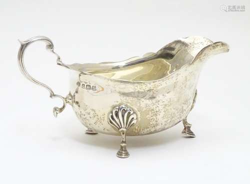 A silver sauce boat hallmarked Birmingham 1936 maker Elkington & Co. 6 1/