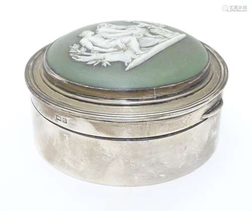 A silver pot having hinged lid set with jasperware cabochon depicting two classical figures.