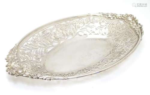 A silver dish with pierced floral decoration hallmarked Sheffield 1996 maker SC. 10