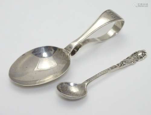 A child's silver spoon hallmarked Birmingham 1915 maker Crisford & Norris Ltd. Together with a