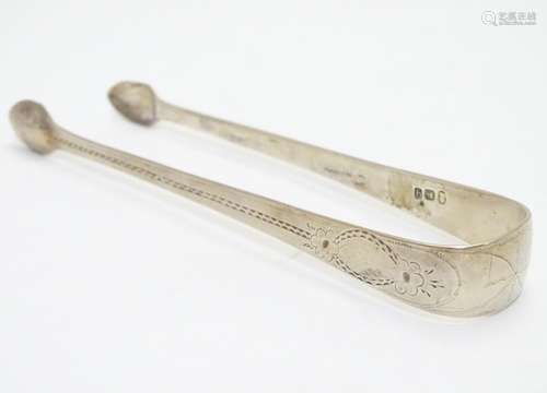 Geo III silver sugar tongs with bright cut decoration hallmarked London 1791 maker GW. 5 1/4