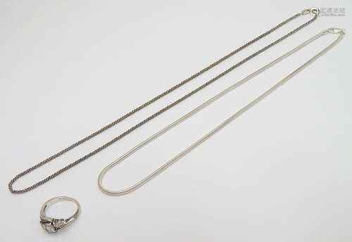 Silver jewellery comprising two chain necklaces and a ring set with five graduated cubic