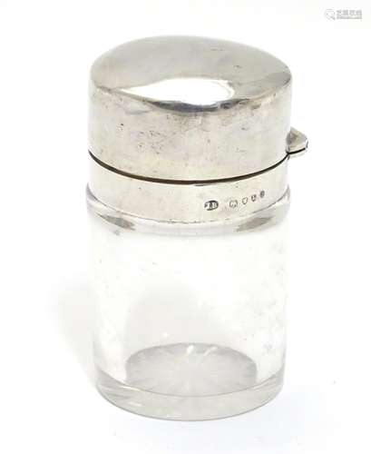 A Victorian glass scent/salts bottle with stopper and silver hinged lid. Hallmarked London 1886