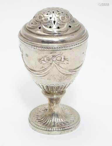 A Geo IV silver pepperette of urn form. Hallmarked London 1823 maker J.A. 3 1/2