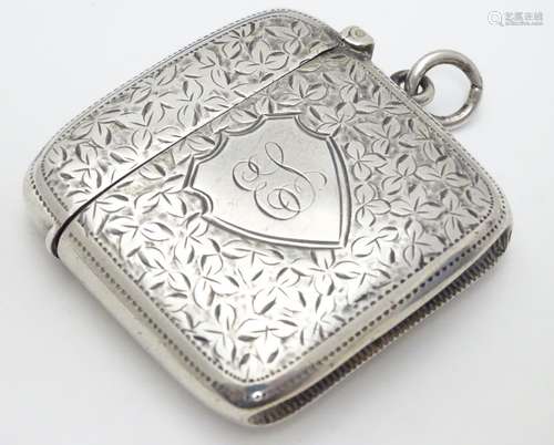 A silver vesta case with engraved foliate decoration hallmarked Birmingham 1900 maker Hilliard &