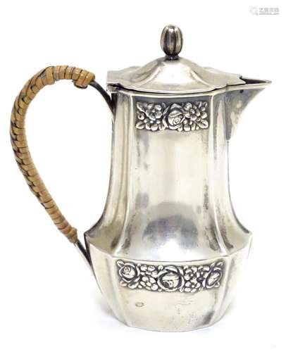 A Continental .800 silver jug with floral detail. Maker M&M Approx 4