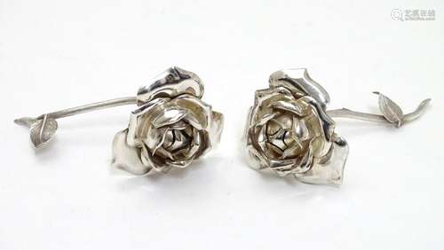 A pair of sterling silver roses marked 'Spain' and bearing importers marks for Israel Freeman & Son.