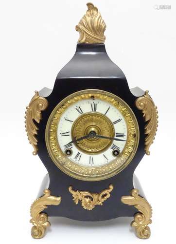 An early 20thC Ansonia mantel clock, of plate metal construction with blacked and gilt finish, the