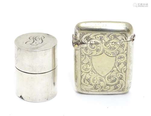 A silver vesta case of cylindrical form with striker under 1 1/4