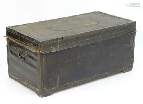 A Regency leather bound camphor wood trunk with brass stud detailing and flanked by carrying