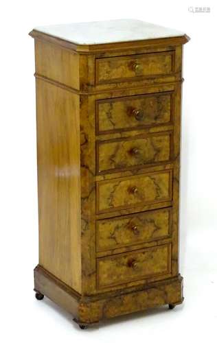 A 19thC walnut marble topped pot cupboard / bedside cabinet, with four short drawers and a drop