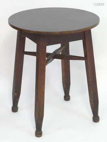 Vintage Retro, Mid-Century: a circular occasional table, the base consisting of four carved beech