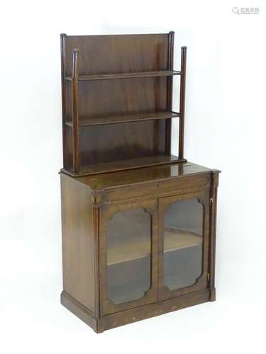 A 19thC mahogany Gothic glazed bookcase, writing desk with a three tier bookcase flanked by