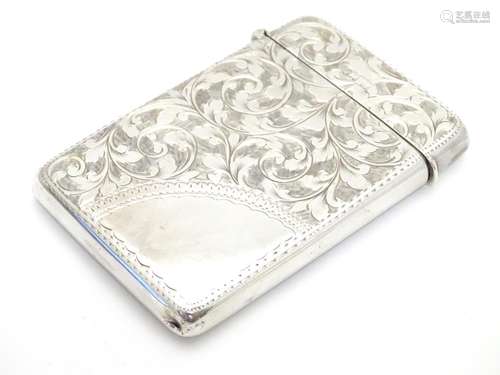 A silver card case with engraved decoration hallmarked 1901 maker Joseph Gloster 3 1/2