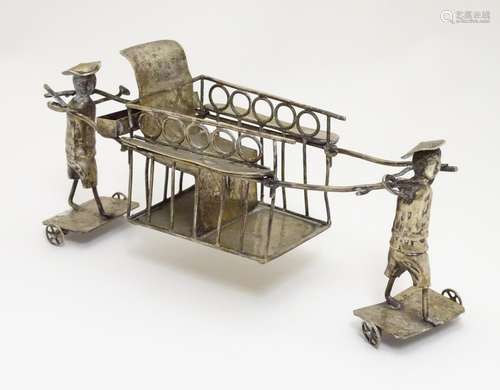 A silver plate model of an Oriental rickshaw, possibly a table coaster. Approx 8 1/2