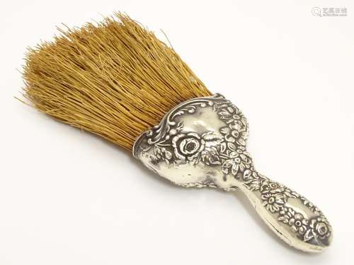 A brush with white metal handle having embossed decoration 8