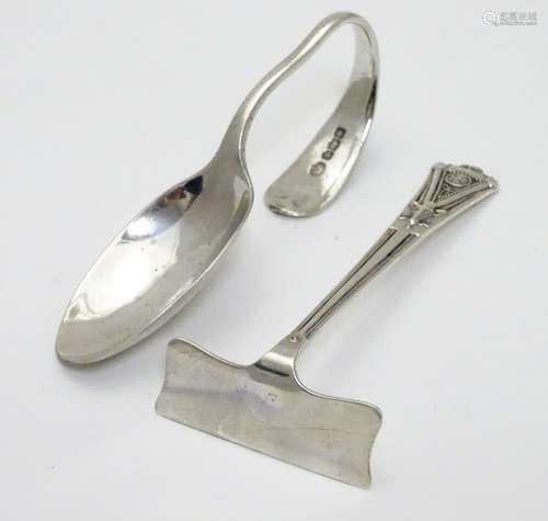 An Art Deco silver child's pusher hallmarked Birmingham 1961 maker Adie Bros Ltd. Together with an