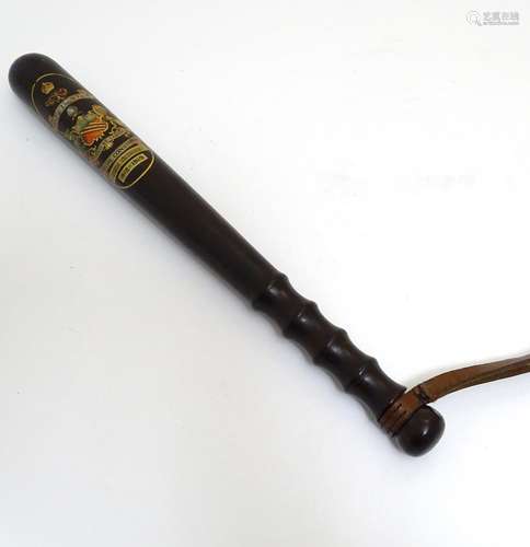 An early 20thC Manchester Police Special Constable's truncheon with leather strap by J. Tyzack &