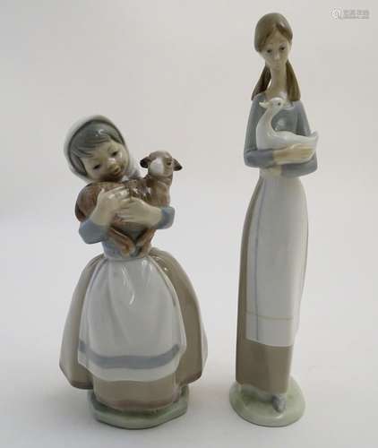 Two Nao figures of girls holding animals, Girl Holding a Lamb, model no. 4525, and Girl Holding a