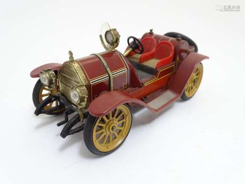 Toys: A Schuco tinplate clockwork car, Mercer, model no. 1225. Approx. 3