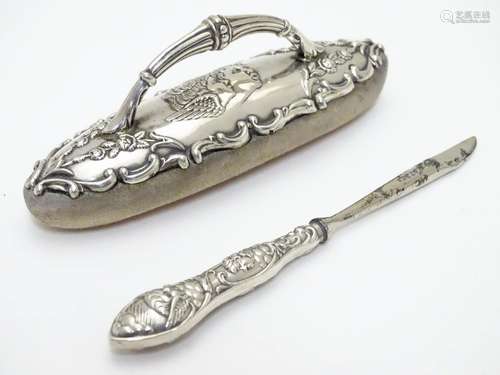 A silver mounted nail buffer with embossed angel detail hallmarked Birmingham 1902 maker Adie Bros