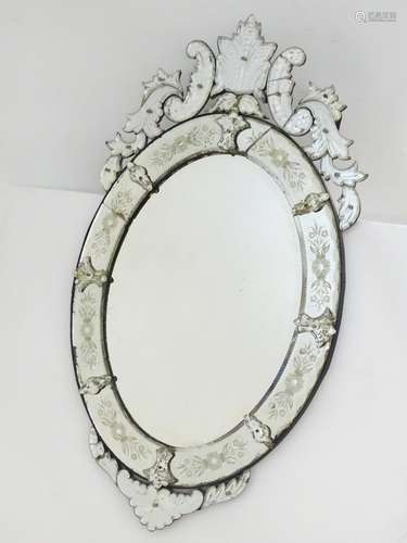 A 19thC Venetian style mirror with floral decoration and adornments. 27