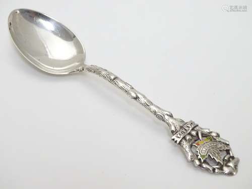 A Canadian Sterling Silver Souvenir Spoon, the handle of branch form titled Canada, decorated with