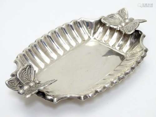 A Spanish silver dish with butterfly decoration. 4 1/4