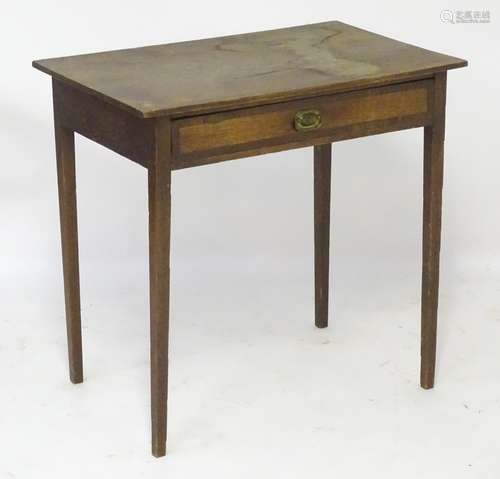 A late 18thC / early 19thC oak side table with a rectangular top above a single long drawer with