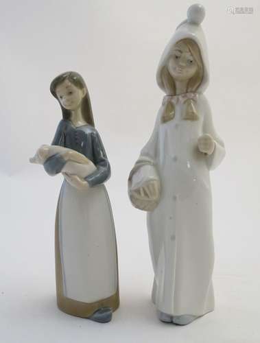 Two Lladro figures to include a girl holding a piglet Girl with Pig, model no. 1011, and Girl with