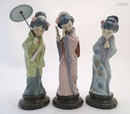 Three Lladro figures modelled as Japanese geisha girls, Oriental Spring, a girl holding a parasol,