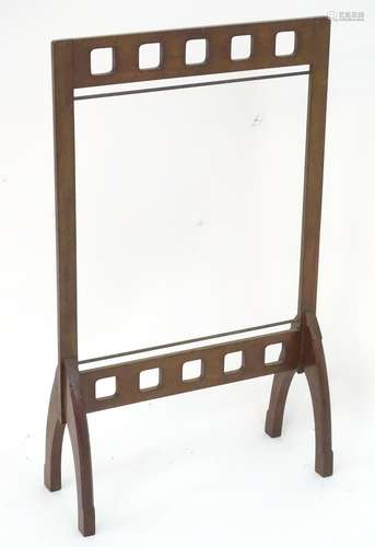 A late 19thC / early 20thC mahogany fire screen frame. In the Glasgow school style. 21