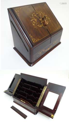 A 19th / early 20thC stationary / correspondence cabinet with folding doors inlaid with marquetry