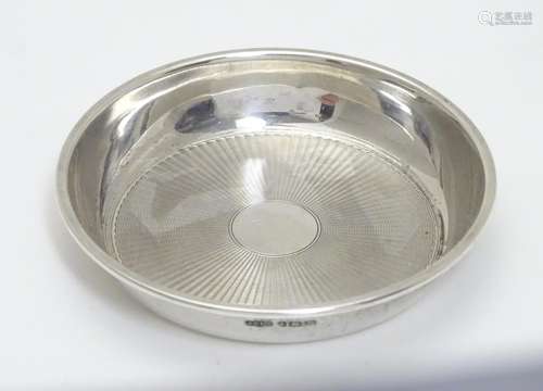 A silver pin dish with engine turned decoration hallmarked Birmingham 1921 maker Joseph Gloster