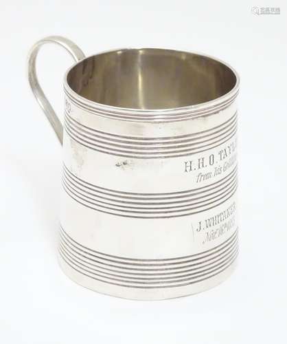 A silver christening mug with banded decoration and loop handle hallmarked London 1809 maker