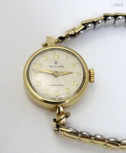 A mid 20th ladies' Rolex precision watch, with 9ct gold case, serial number 24973. 6/8