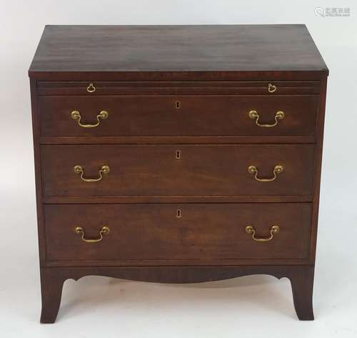 A mid / late 18thC mahogany chest of drawers with a rectangular top above a brushing slide and three