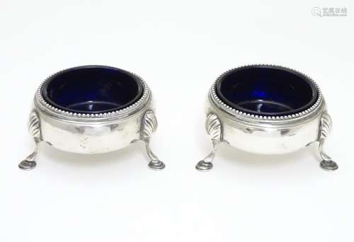 A pair of Victorian silver table salts with blue glass liners. Hallmarked London 1878 maker Richards