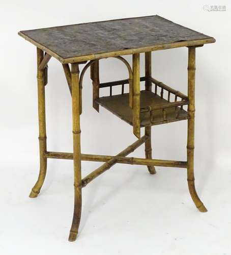 A late 19thC Meiji period side table with an rectangular top having a handmade embossed and gilt