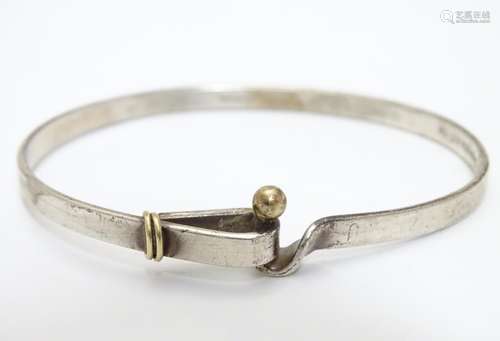 A silver bracelet of bangle form by Tiffany & Co. Hallmarked London 2003 Please Note - we do not