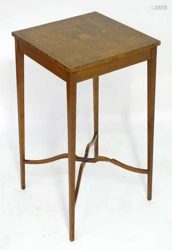 A late 18thC satinwood table with a squared and marquetry inlaid top above squared tapering legs